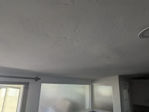 Ceiling repaired, textured and repainted after a leak