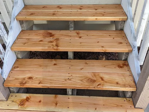 New cedar front steps built and set with adjusted risers