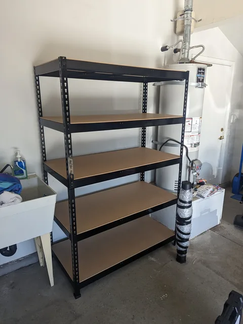 Garage storage shelving assembled and anchored