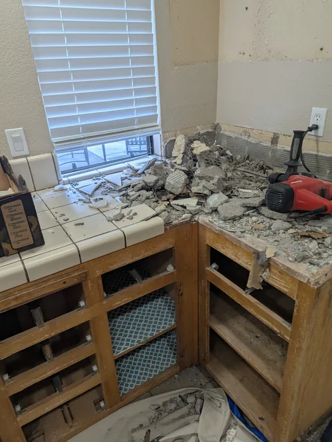 Old tile countertop removed from kitchen cabinets